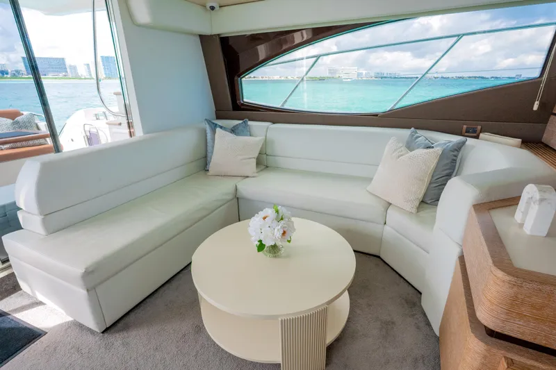 Golden Sun Yacht Photos Pics Luxurious interior of 2011 Azimut 58 yacht with white seating and ocean view.