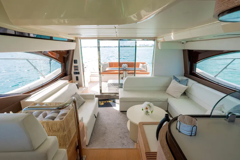 Golden Sun Yacht Photos Pics Luxurious interior of 2011 Azimut 58 yacht with elegant seating and ocean view.