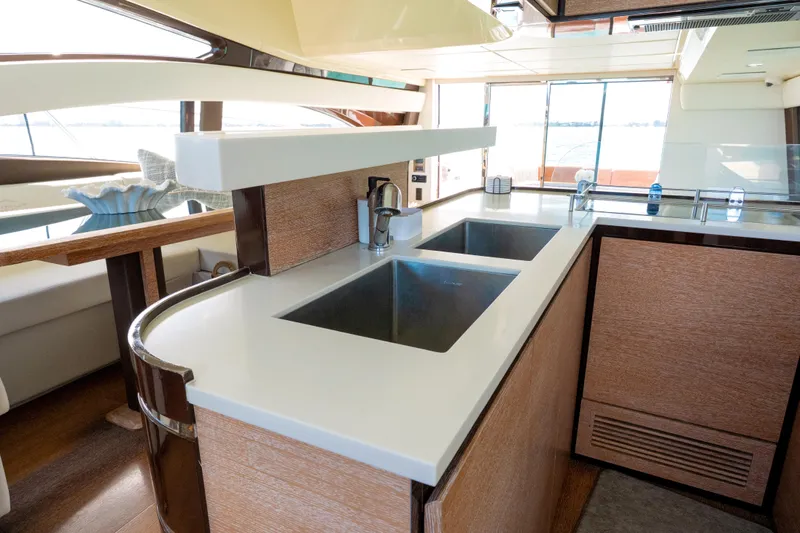 Golden Sun Yacht Photos Pics Luxurious kitchen interior of 2011 Azimut 58 yacht with modern fixtures and dual sinks.