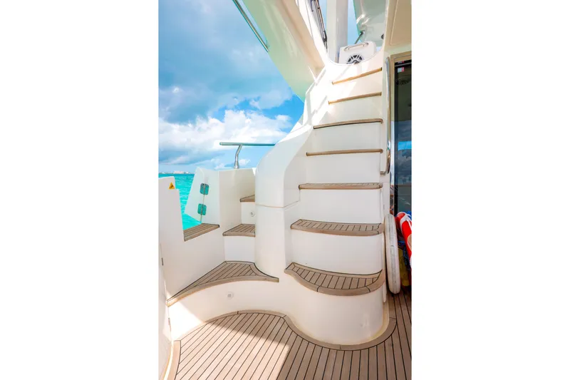 Golden Sun Yacht Photos Pics Staircase on 2011 Azimut 58 yacht with ocean view and clear sky.