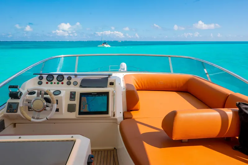 Golden Sun Yacht Photos Pics Cockpit view of 2011 Azimut 58 yacht with turquoise ocean backdrop.