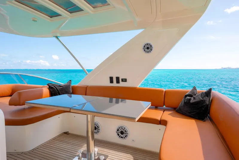 Golden Sun Yacht Photos Pics Luxurious 2011 Azimut 58 yacht interior with ocean view, featuring elegant seating and table.