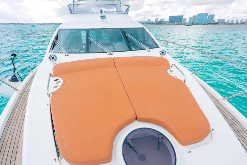 Golden Sun Yacht Photos Pics Luxurious 2011 Azimut 58 yacht with spacious sunbathing deck on turquoise waters.