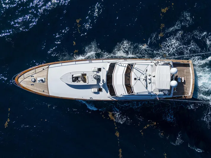 Thanks Buds Yacht Photos Pics Aerial view of 1985 Feadship Yacht Fisherman cruising on open water.