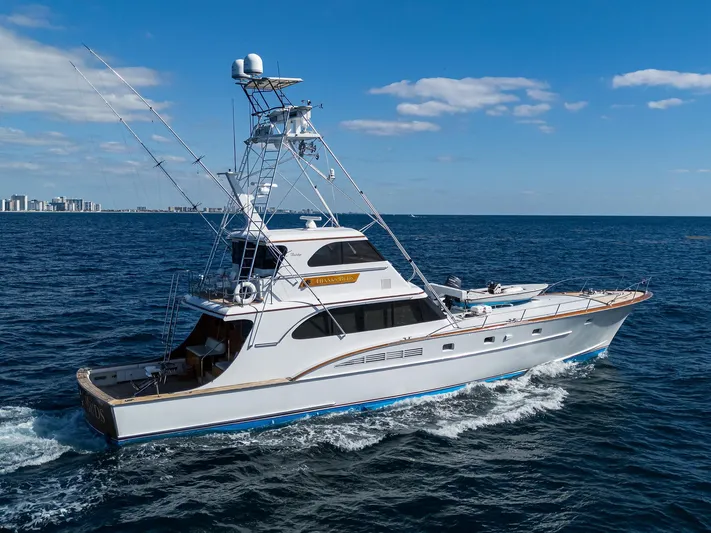 Thanks Buds Yacht Photos Pics 1985 Feadship Yacht Fisherman cruising on open sea under clear blue sky.