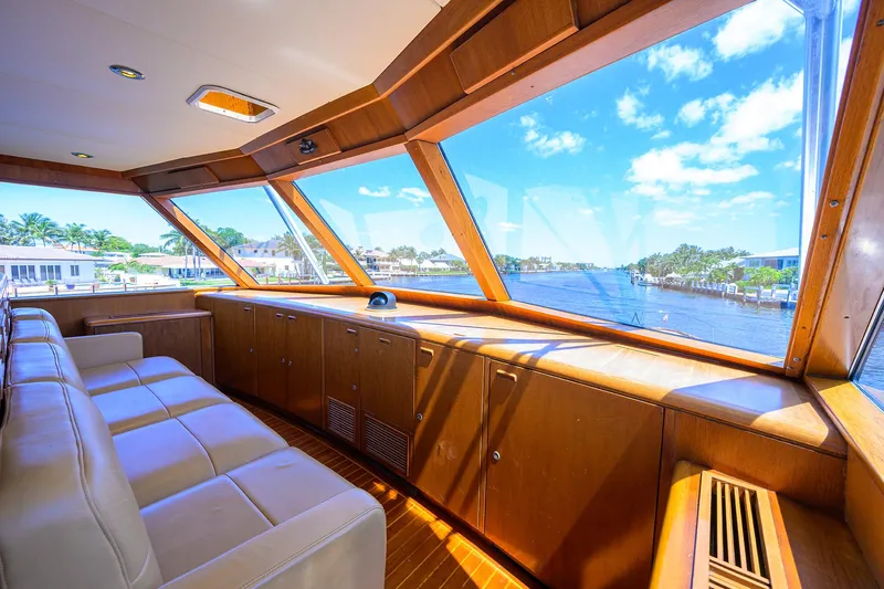Thanks Buds Yacht Photos Pics Luxurious interior of a 1985 Feadship Yacht Fisherman with panoramic windows and plush seating.