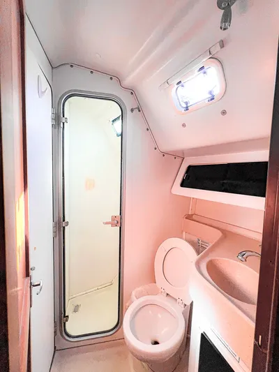 Moondust Yacht Photos Pics Bathroom interior of a 1997 Catalina 380 sailboat, featuring a toilet and shower.