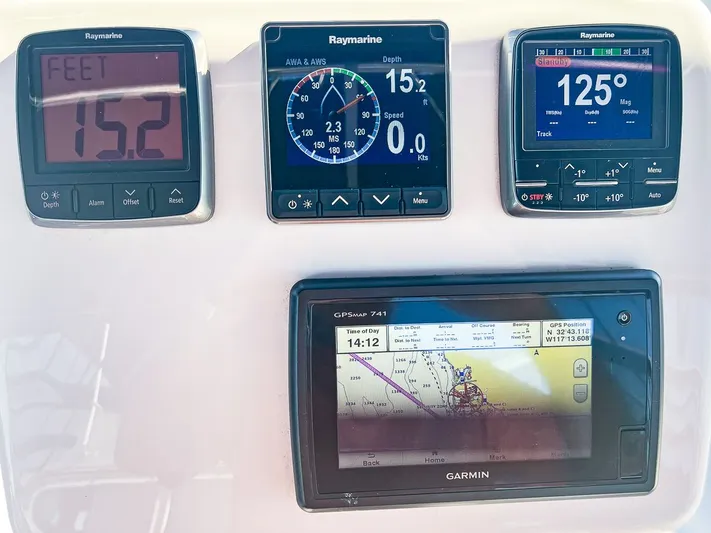 Moondust Yacht Photos Pics Sailing instruments on a 1997 Catalina 380, featuring Raymarine and Garmin displays.