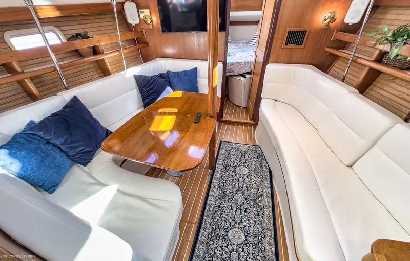 Moondust Yacht Photos Pics Interior of a 1997 Catalina 380 yacht with elegant furnishings.