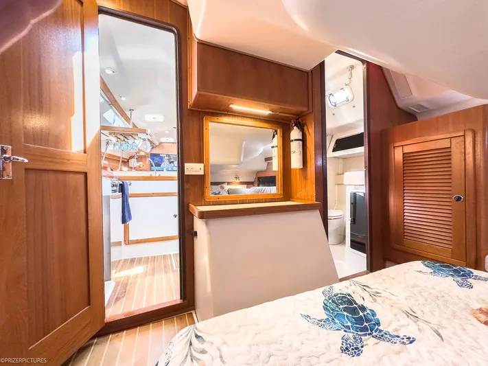 Moondust Yacht Photos Pics Interior of a 1997 Catalina 380 yacht with wooden furnishings.