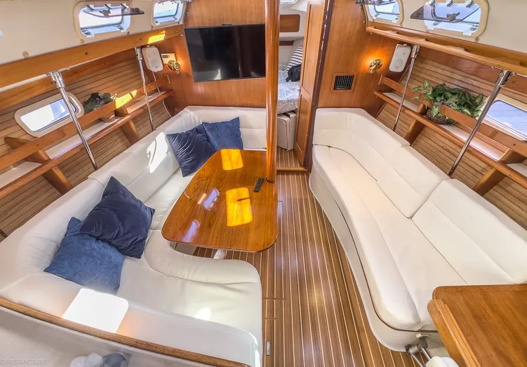 Moondust Yacht Photos Pics Interior of a 1997 Catalina 380 yacht with elegant wood finish.
