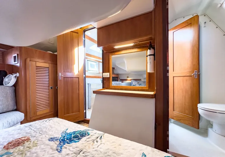 Moondust Yacht Photos Pics Interior of a 1997 Catalina 380 yacht with wooden furnishings.
