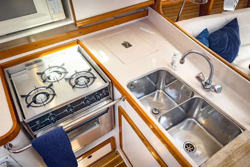 Moondust Yacht Photos Pics 1997 Catalina 380 yacht kitchen with stove and sink.