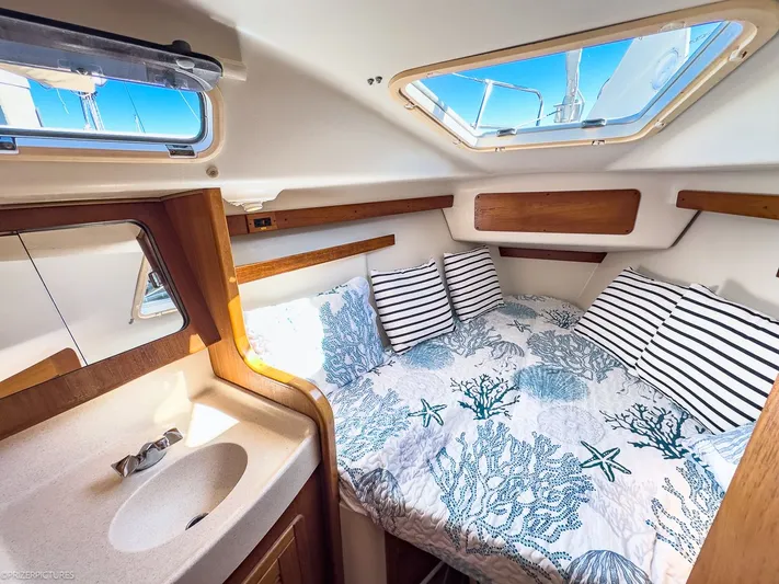 Moondust Yacht Photos Pics Interior of a 1997 Catalina 380 yacht with cozy bed.