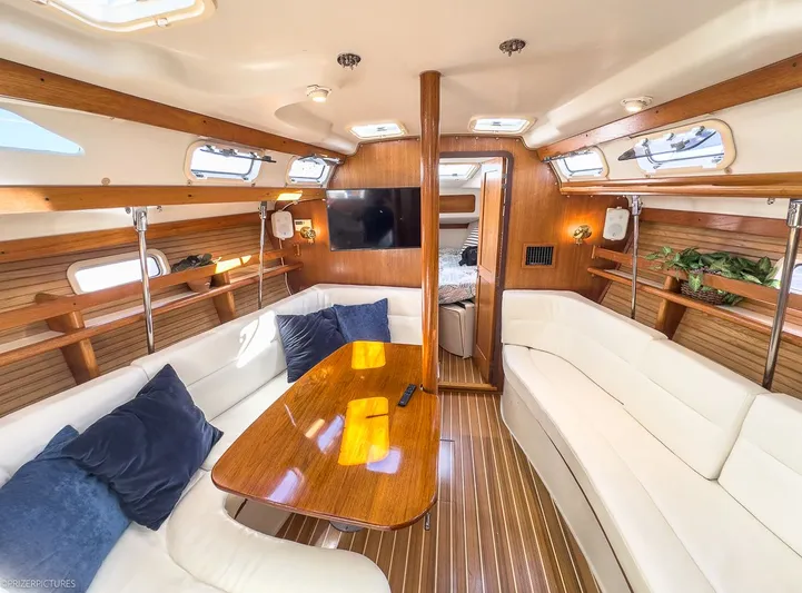 Moondust Yacht Photos Pics Interior of a 1997 Catalina 380 yacht with wooden furnishings.