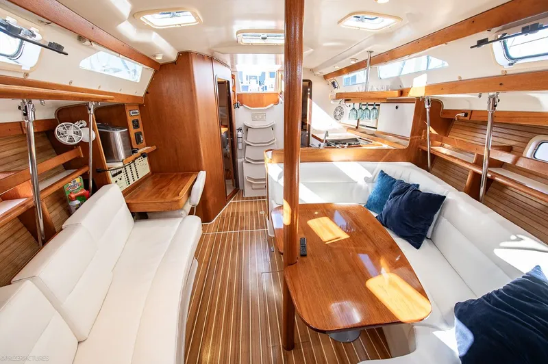 Moondust Yacht Photos Pics Interior of a 1997 Catalina 380 yacht with wooden furnishings.