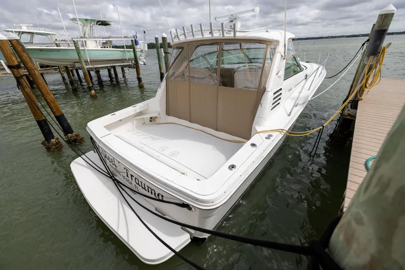  Yacht Photos Pics 2000 Sea Ray 370 Express Cruiser docked at marina, rear view.