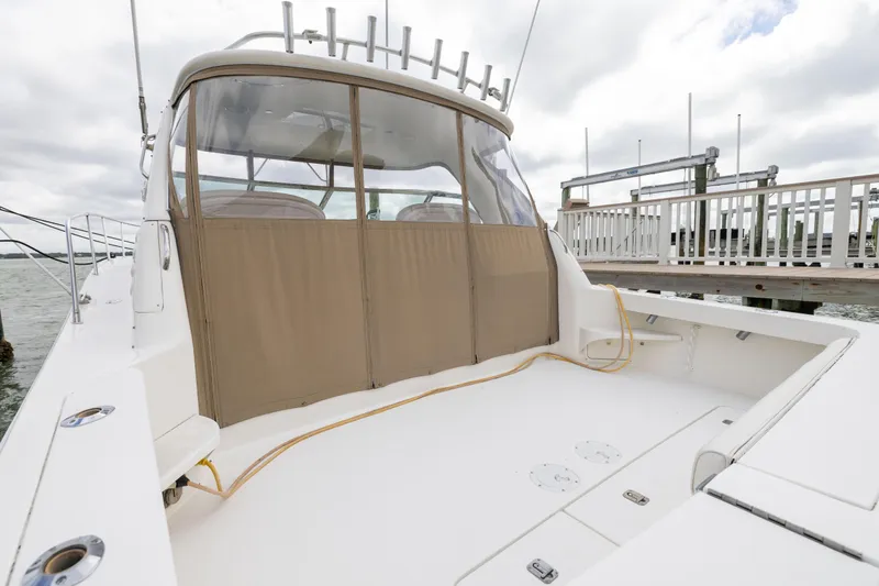  Yacht Photos Pics 2000 Sea Ray 370 Express Cruiser docked, featuring spacious deck and covered cockpit area.