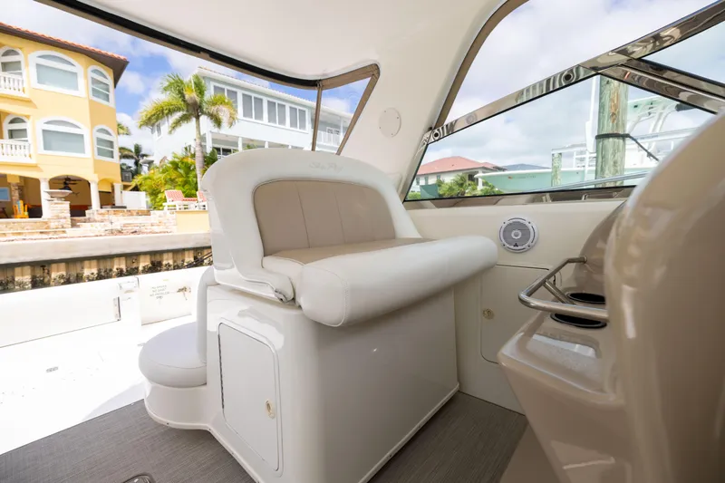  Yacht Photos Pics Interior of 2000 Sea Ray 370 Express Cruiser with plush seating and waterfront view.