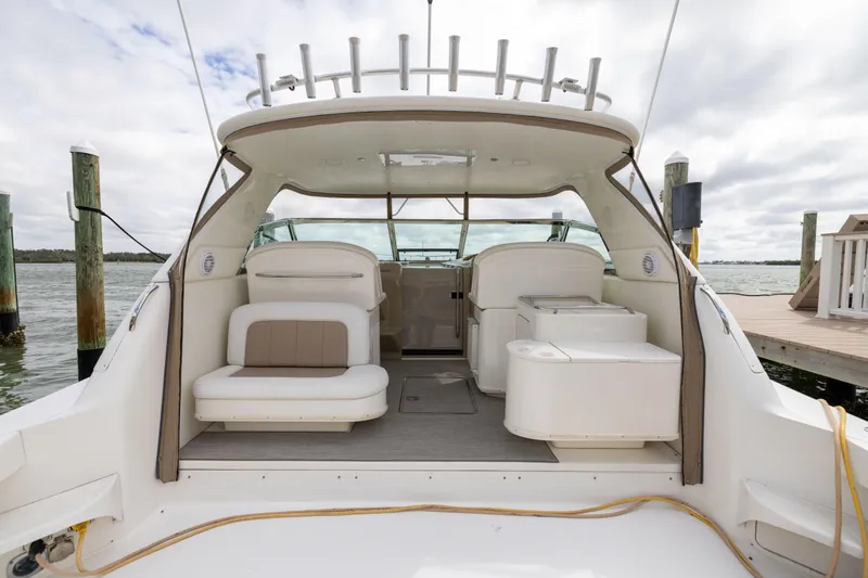  Yacht Photos Pics 2000 Sea Ray 370 Express Cruiser interior with seating, docked by the water.
