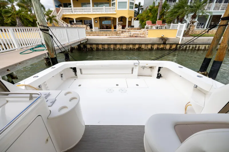  Yacht Photos Pics 2000 Sea Ray 370 Express Cruiser's spacious deck at a marina, with waterfront view.