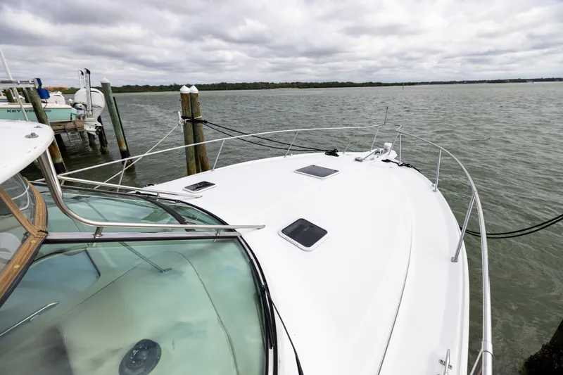  Yacht Photos Pics 2000 Sea Ray 370 Express Cruiser docked, showcasing sleek design and spacious deck.