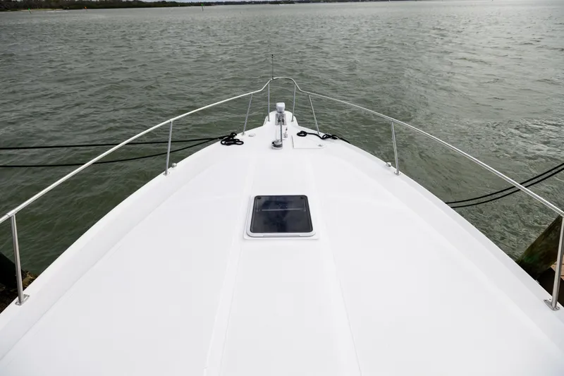  Yacht Photos Pics Bow view of 2000 Sea Ray 370 Express Cruiser on calm waters.