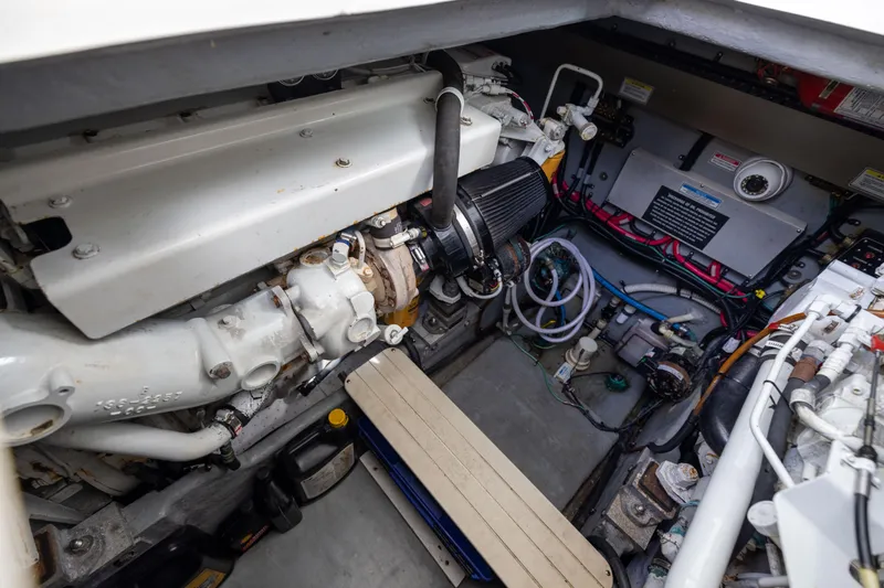  Yacht Photos Pics Engine compartment of 2000 Sea Ray 370 Express Cruiser, showcasing mechanical components and wiring.