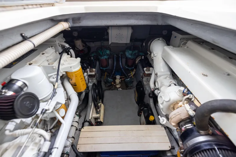  Yacht Photos Pics Engine room of a 2000 Sea Ray 370 Express Cruiser, showcasing mechanical components.