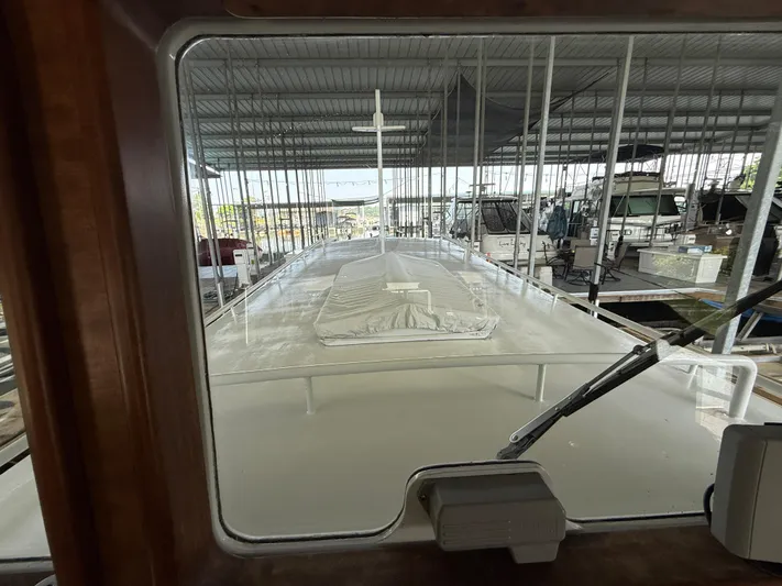 Passage Yacht Photos Pics View from inside a 2009 Custom Dutch Canal Barge docked in a covered marina.