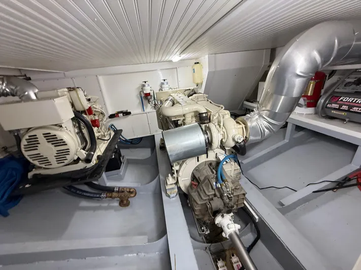 Passage Yacht Photos Pics Engine room of a 2009 Custom Dutch Canal Barge, featuring mechanical components and piping.