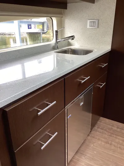  Yacht Photos Pics Modern kitchen in 2018 Regal 42 Fly yacht with sleek cabinetry and stainless steel sink.