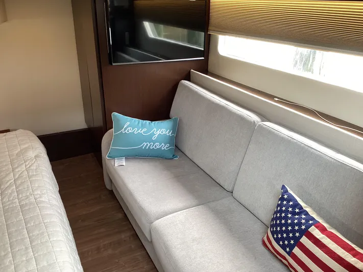  Yacht Photos Pics Interior of 2018 Regal 42 Fly yacht with cozy sofa and decorative pillows.