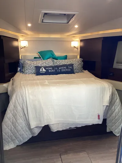  Yacht Photos Pics Luxurious bedroom interior of 2018 Regal 42 Fly yacht with cozy bedding.