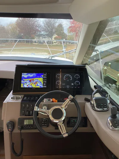  Yacht Photos Pics 2018 Regal 42 Fly yacht helm with navigation screens and controls.