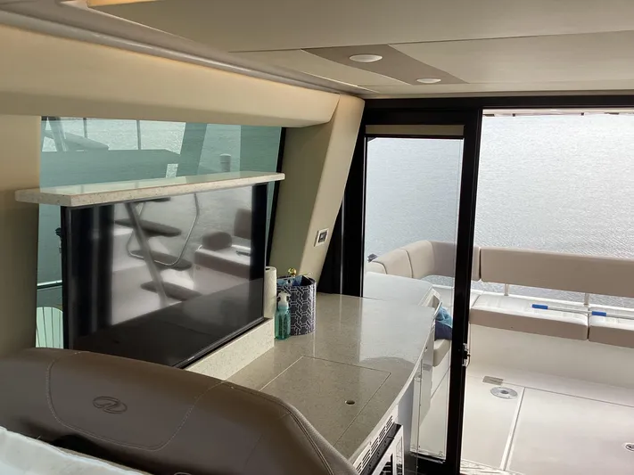  Yacht Photos Pics Interior of 2018 Regal 42 Fly yacht with modern seating and large windows.