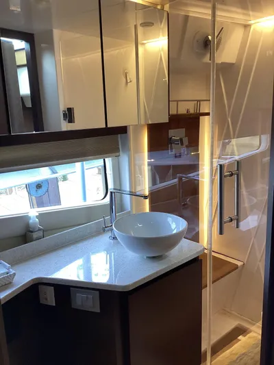  Yacht Photos Pics Luxurious bathroom in 2018 Regal 42 Fly yacht with modern fixtures and elegant design.