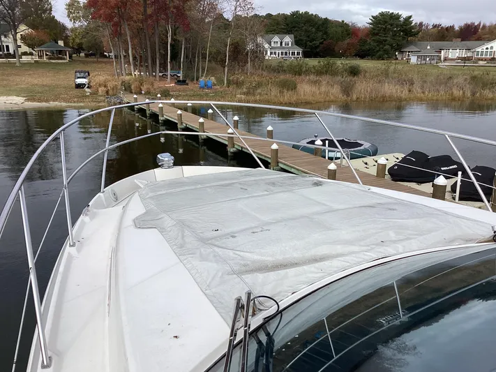  Yacht Photos Pics Regal 42 Fly 2018 yacht docked by a scenic lakeside pier.