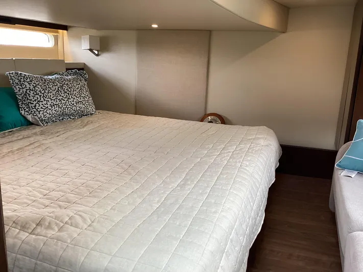  Yacht Photos Pics Luxurious bedroom interior of 2018 Regal 42 Fly yacht with cozy bedding.