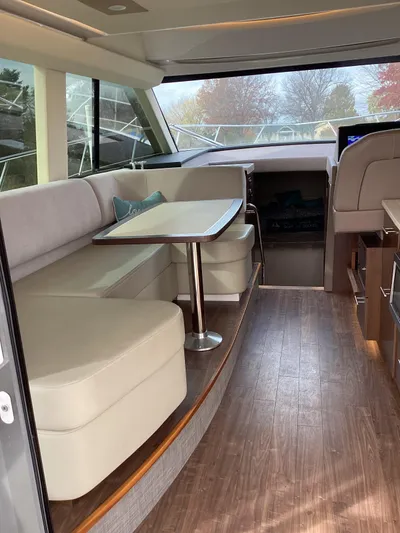  Yacht Photos Pics Interior of 2018 Regal 42 Fly yacht with elegant seating and dining area.