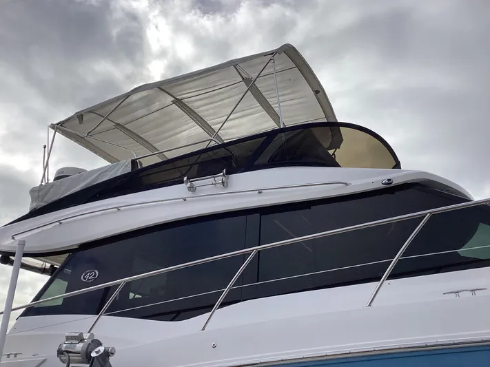 Yacht Photos Pics 2018 Regal 42 Fly yacht with sleek design and canopy, viewed from below.