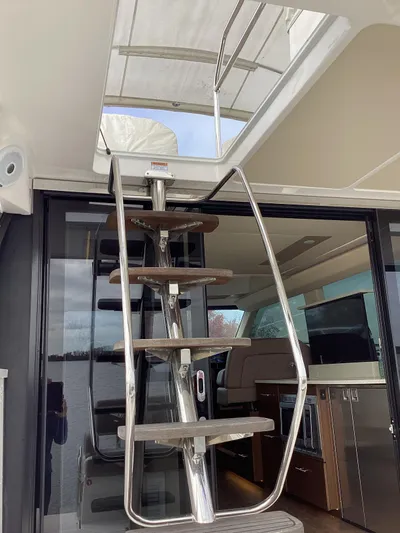  Yacht Photos Pics Stainless steel staircase on 2018 Regal 42 Fly yacht, leading to upper deck.