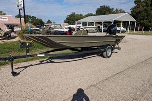 2025 Tracker Grizzly 1754 SC boat on trailer in outdoor dealership setting.