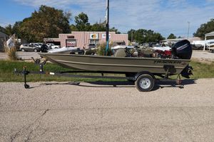 2025 Tracker Grizzly 1754 SC boat on trailer, parked outdoors at dealership.