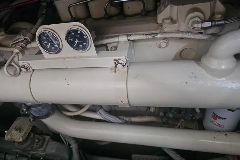 Tenacious Yacht Photos Pics Engine compartment of a 1990 Sea Ray 380 Aft Cabin with gauges and pipes.