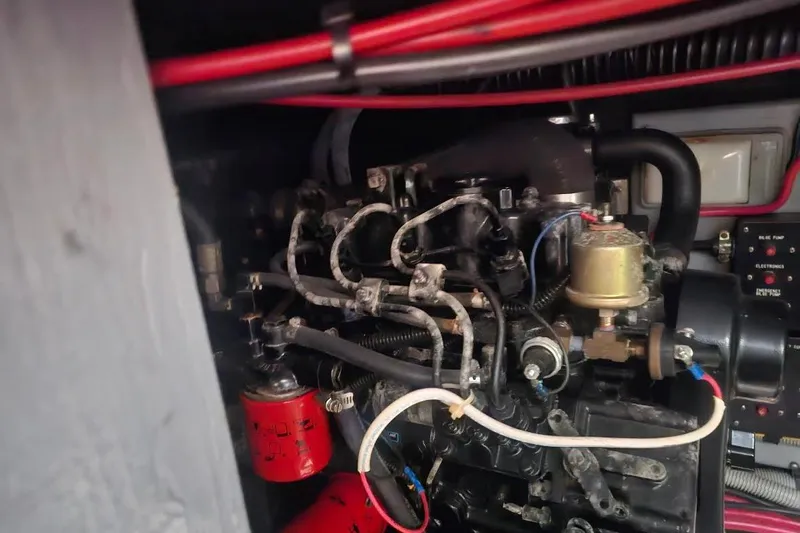 Tenacious Yacht Photos Pics Engine compartment of a 1990 Sea Ray 380 Aft Cabin boat, showing mechanical components.