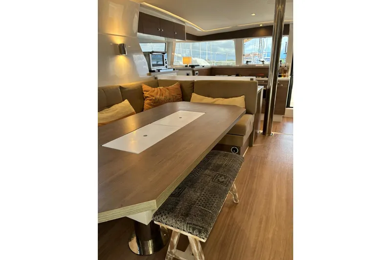 Isthmus Breeze Yacht Photos Pics Luxurious interior of 2023 Bali 4.2 yacht with modern dining area and cozy seating.