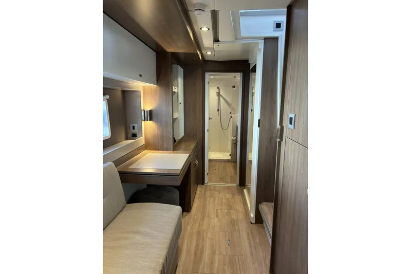 Isthmus Breeze Yacht Photos Pics 2023 Bali 4.2 interior with modern design, featuring a cozy seating area and compact bathroom.