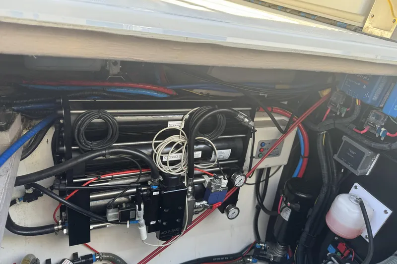 Isthmus Breeze Yacht Photos Pics Engine compartment of a 2023 Bali 4.2, showcasing complex wiring and mechanical components.