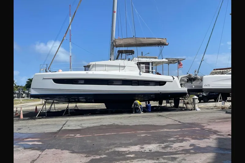 Isthmus Breeze Yacht Photos Pics 2023 Bali 4.2 catamaran on dry dock for maintenance under clear blue sky.